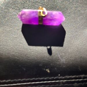 Amethyst crystal pendant with gold plated wrap